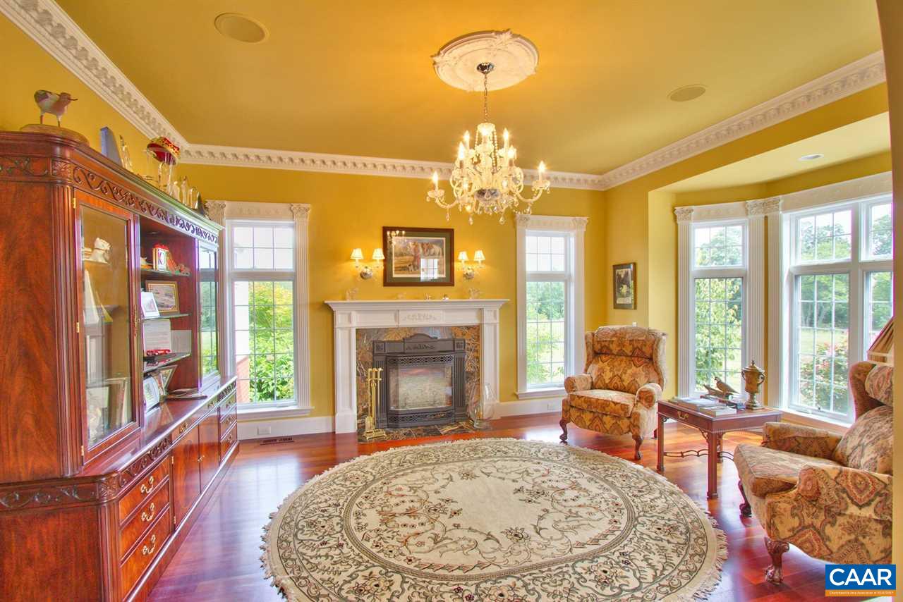 2711 Lowesville Road Roseland, VA 22967 - Photo 13 of 32 a living room with furniture fireplace and a large window