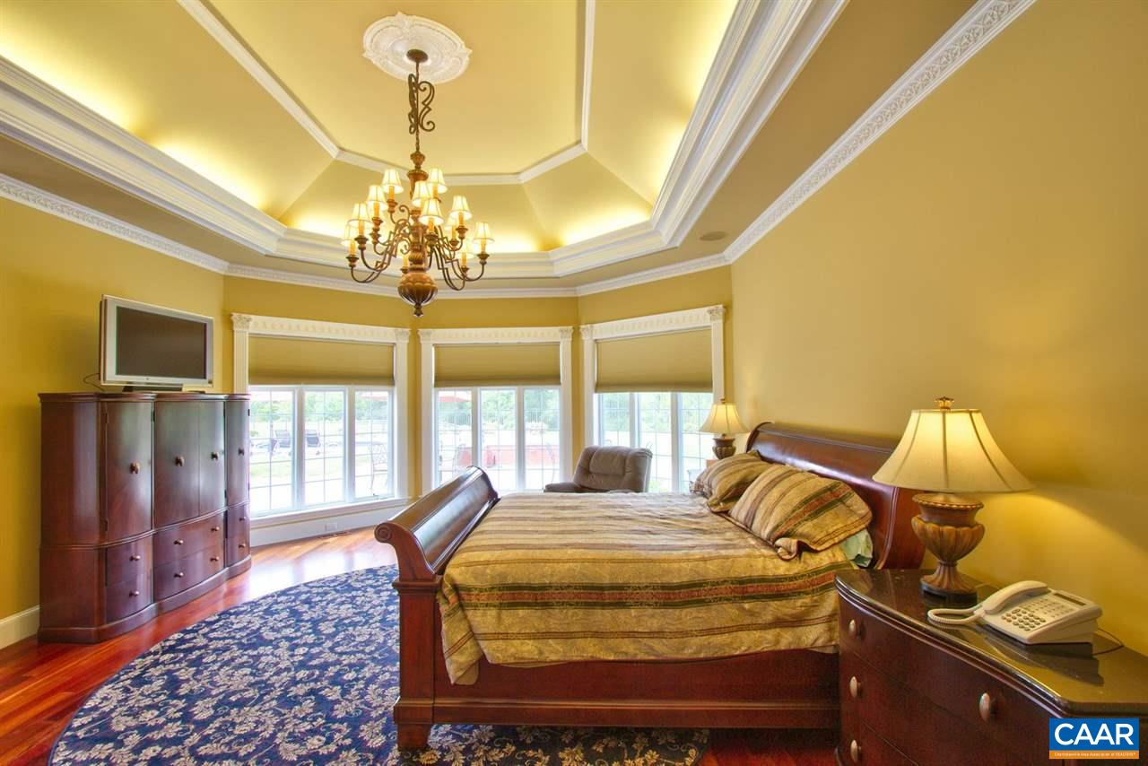 2711 Lowesville Road Roseland, VA 22967 - Photo 17 of 32 a bedroom with a bed and wooden floor