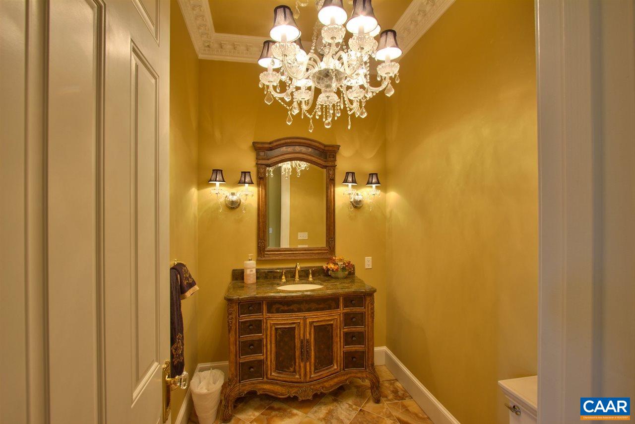 2711 Lowesville Road Roseland, VA 22967 - Photo 18 of 32 a bathroom with a sink a mirror and a shower