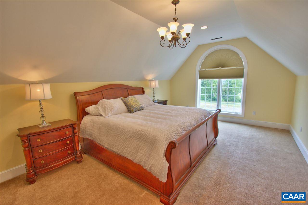 2711 Lowesville Road Roseland, VA 22967 - Photo 19 of 32 a spacious bedroom with a bed dresser and a window