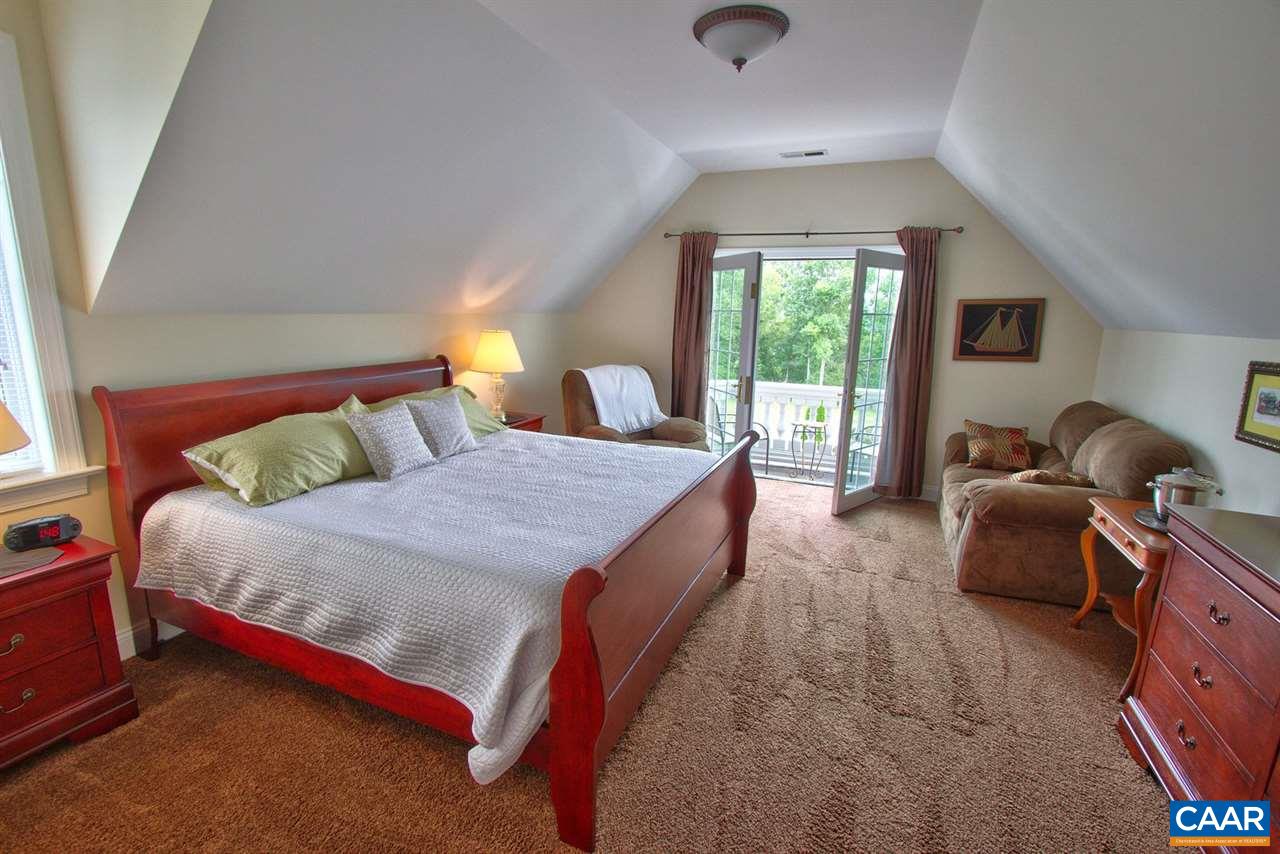 2711 Lowesville Road Roseland, VA 22967 - Photo 22 of 32 a spacious bedroom with a bed and window