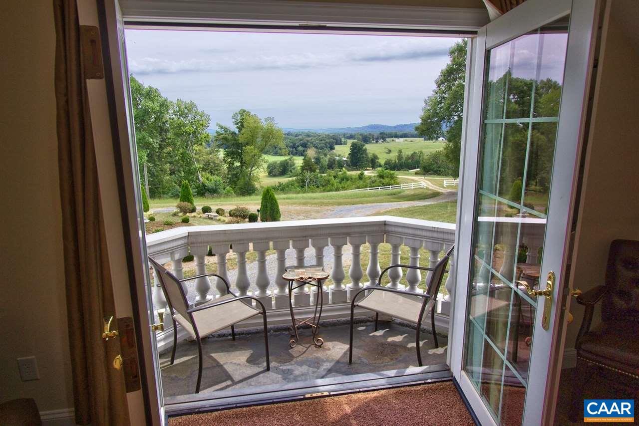 2711 Lowesville Road Roseland, VA 22967 - Photo 23 of 32 a view of a balcony with furniture and front door