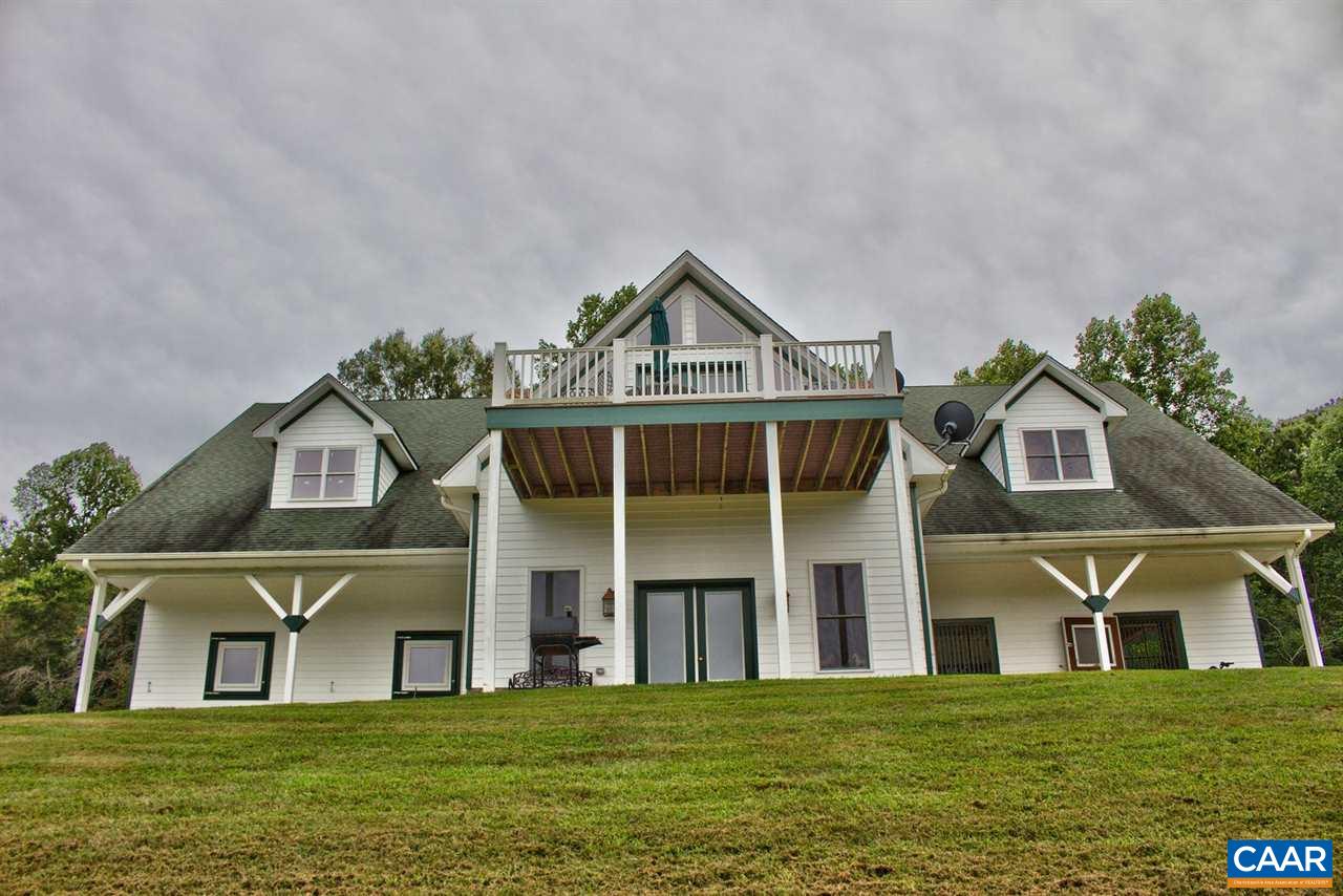 2711 Lowesville Road Roseland, VA 22967 - Photo 25 of 32 a front view of a house with a garden