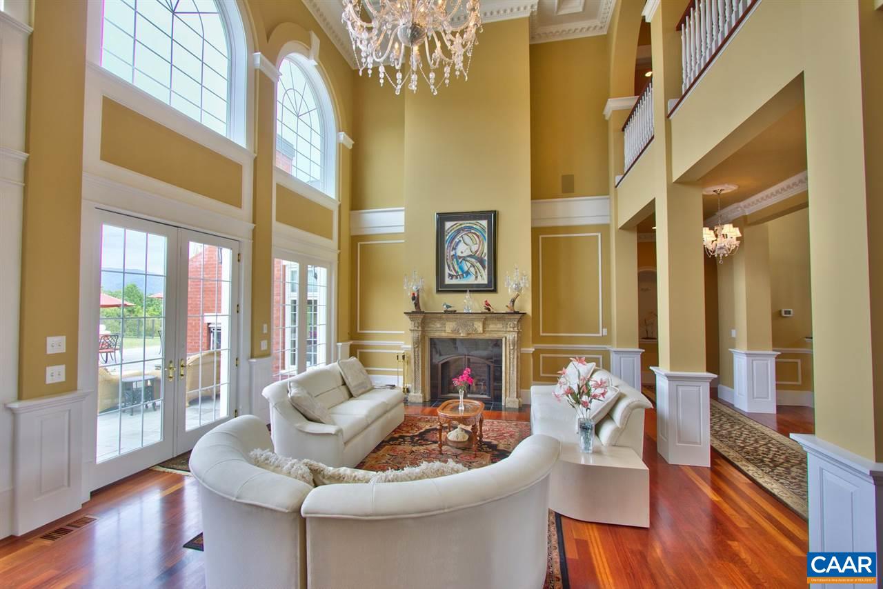 2711 Lowesville Road Roseland, VA 22967 - Photo 6 of 32 a living room with fireplace furniture and a large window