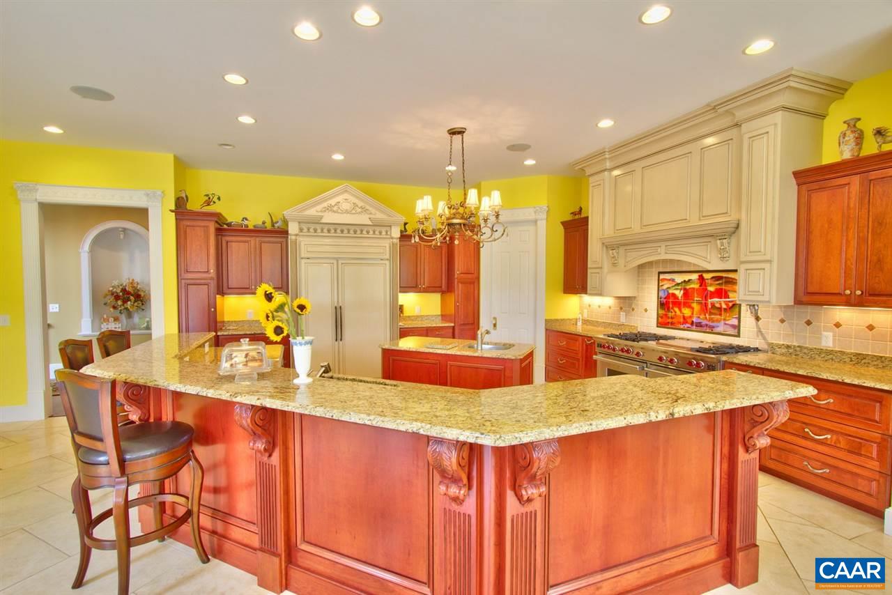 2711 Lowesville Road Roseland, VA 22967 - Photo 9 of 32 a kitchen with kitchen island granite countertop a sink and cabinets