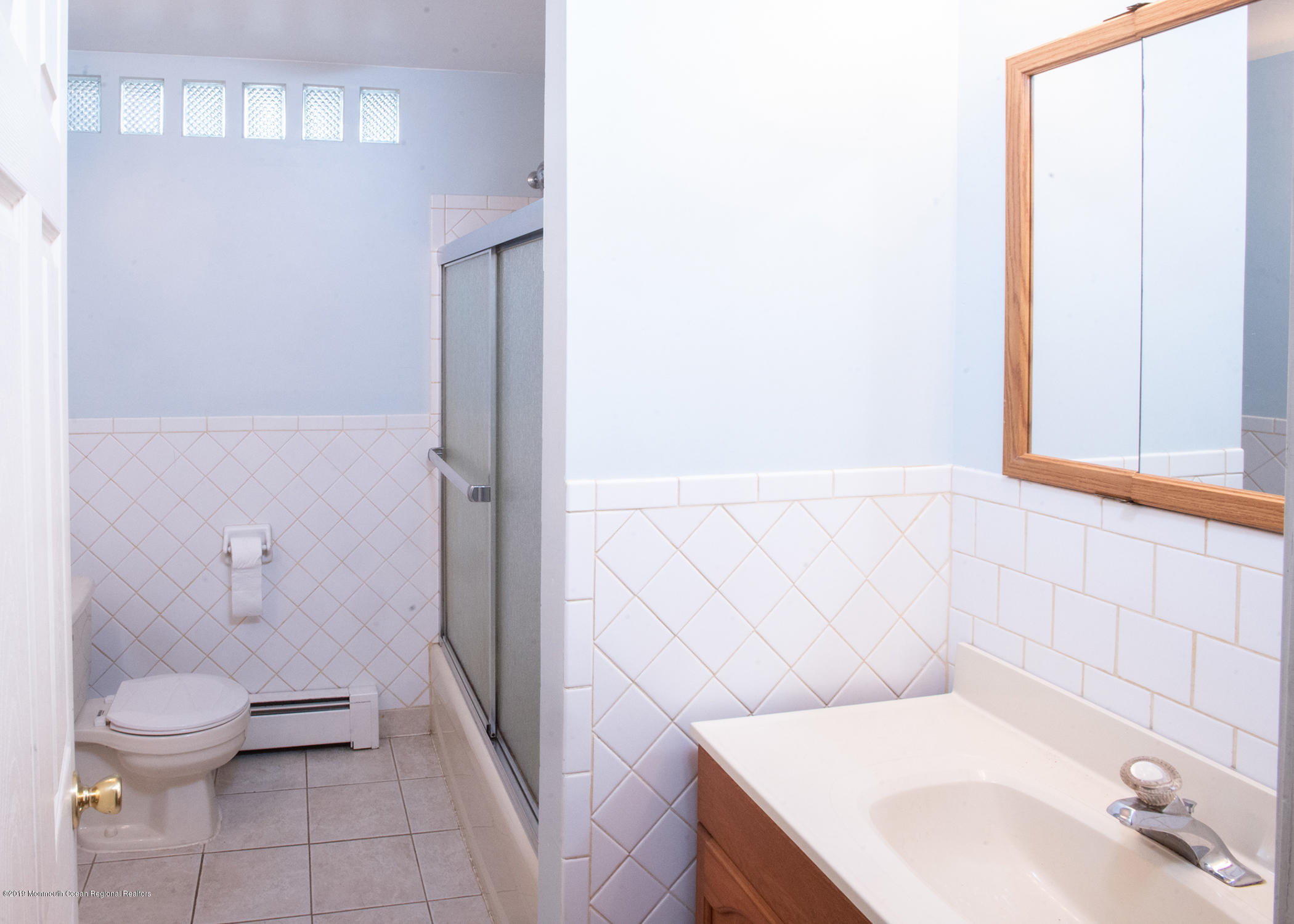 802 West Farms Road Howell, NJ 07731 - Photo 11 of 16 a bathroom with a sink a toilet and shower