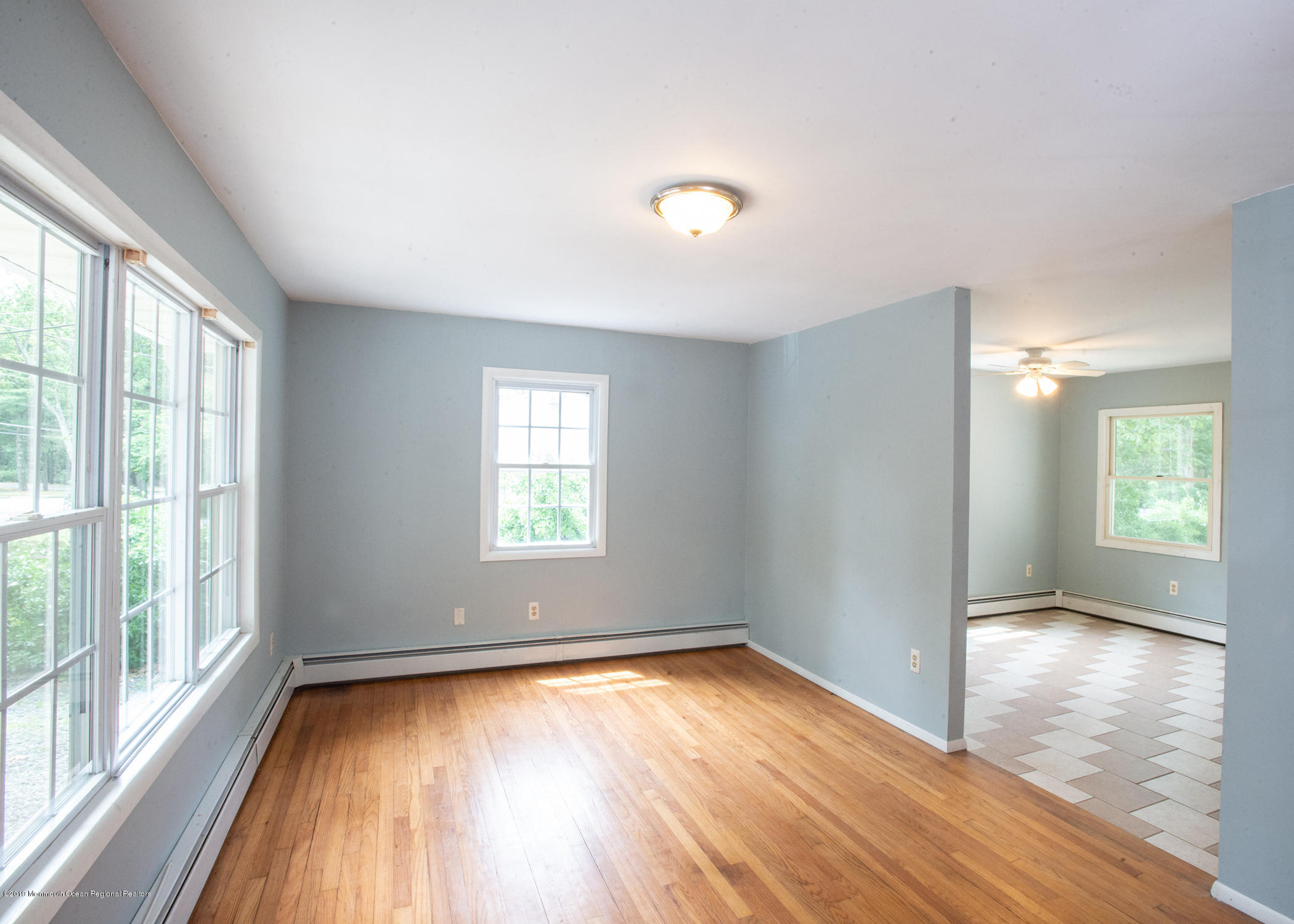 802 West Farms Road Howell, NJ 07731 - Photo 2 of 16 a view of empty room with wooden floor and fan