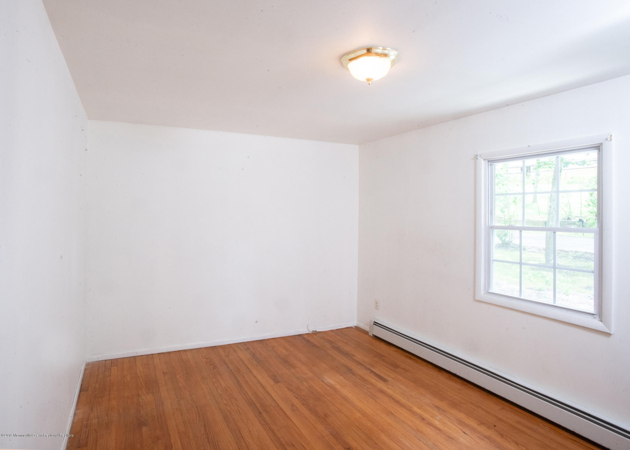 802 West Farms Road Howell, NJ 07731 - Photo 8 of 16 an empty room with a window