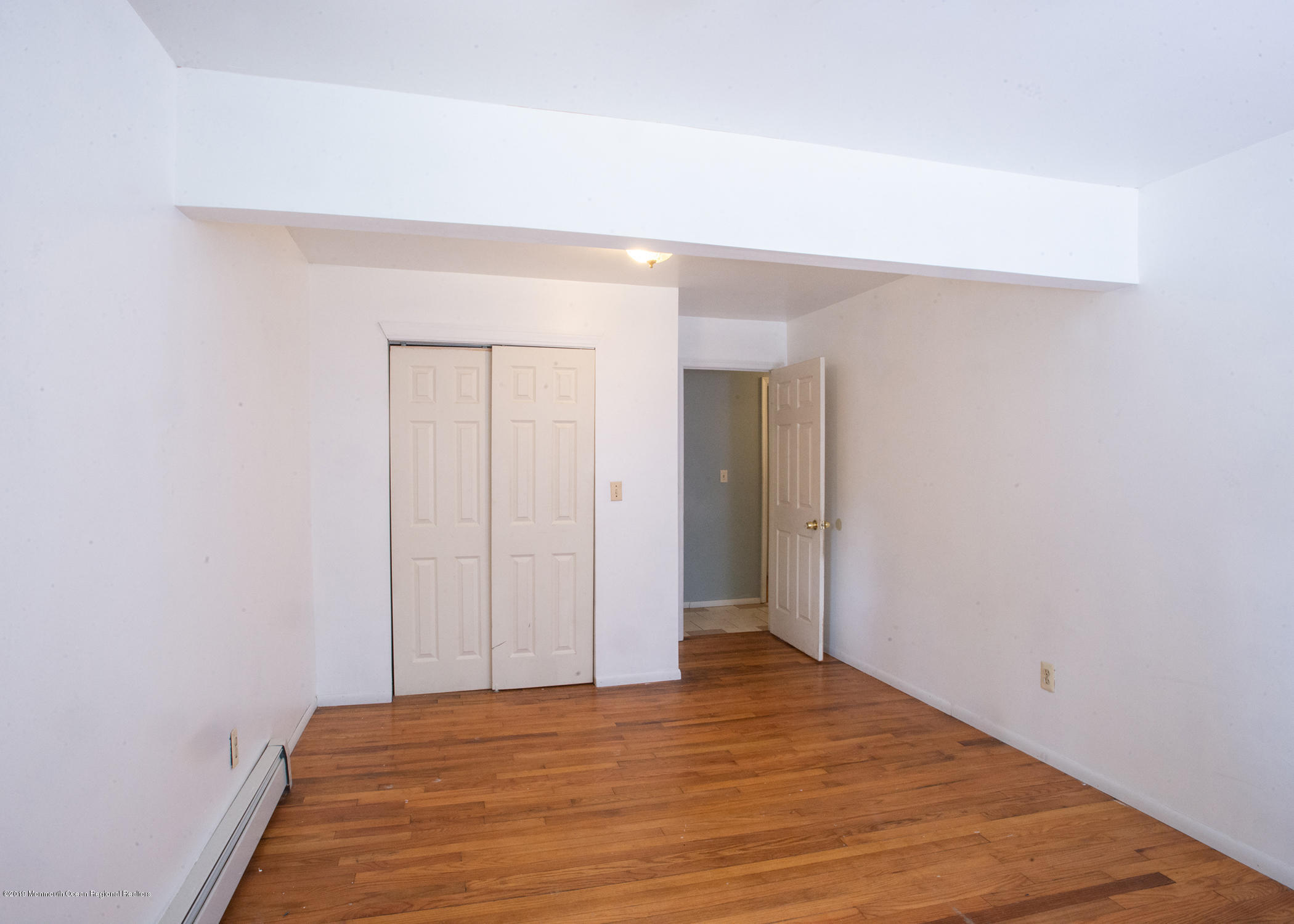 802 West Farms Road Howell, NJ 07731 - Photo 10 of 16 a view of a room with wooden floor and bathroom