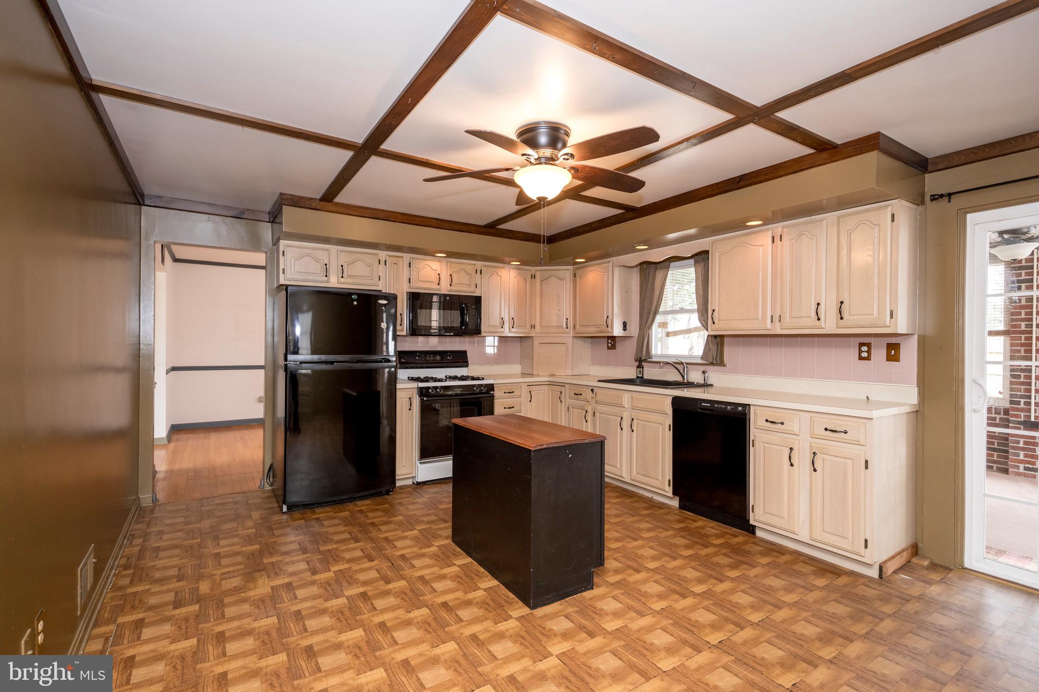 4300 Camellia Road Nottingham, MD 21236 - Photo 14 of 47 a kitchen with granite countertop a refrigerator and a stove top oven