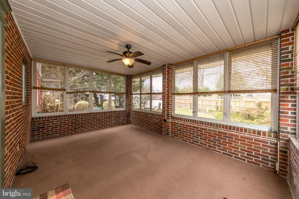 a view of an empty room and a balcony