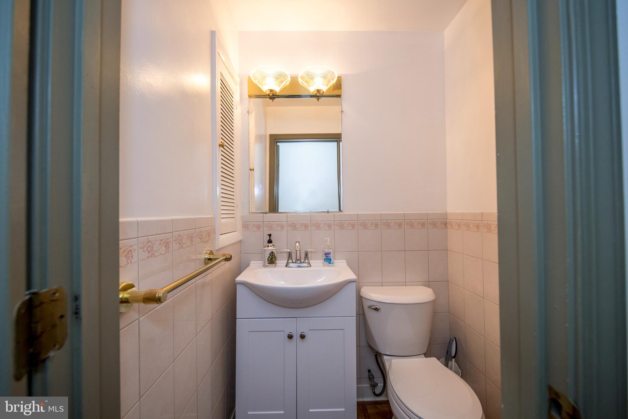 4300 Camellia Road Nottingham, MD 21236 - Photo 22 of 47 a bathroom with a sink toilet and mirror