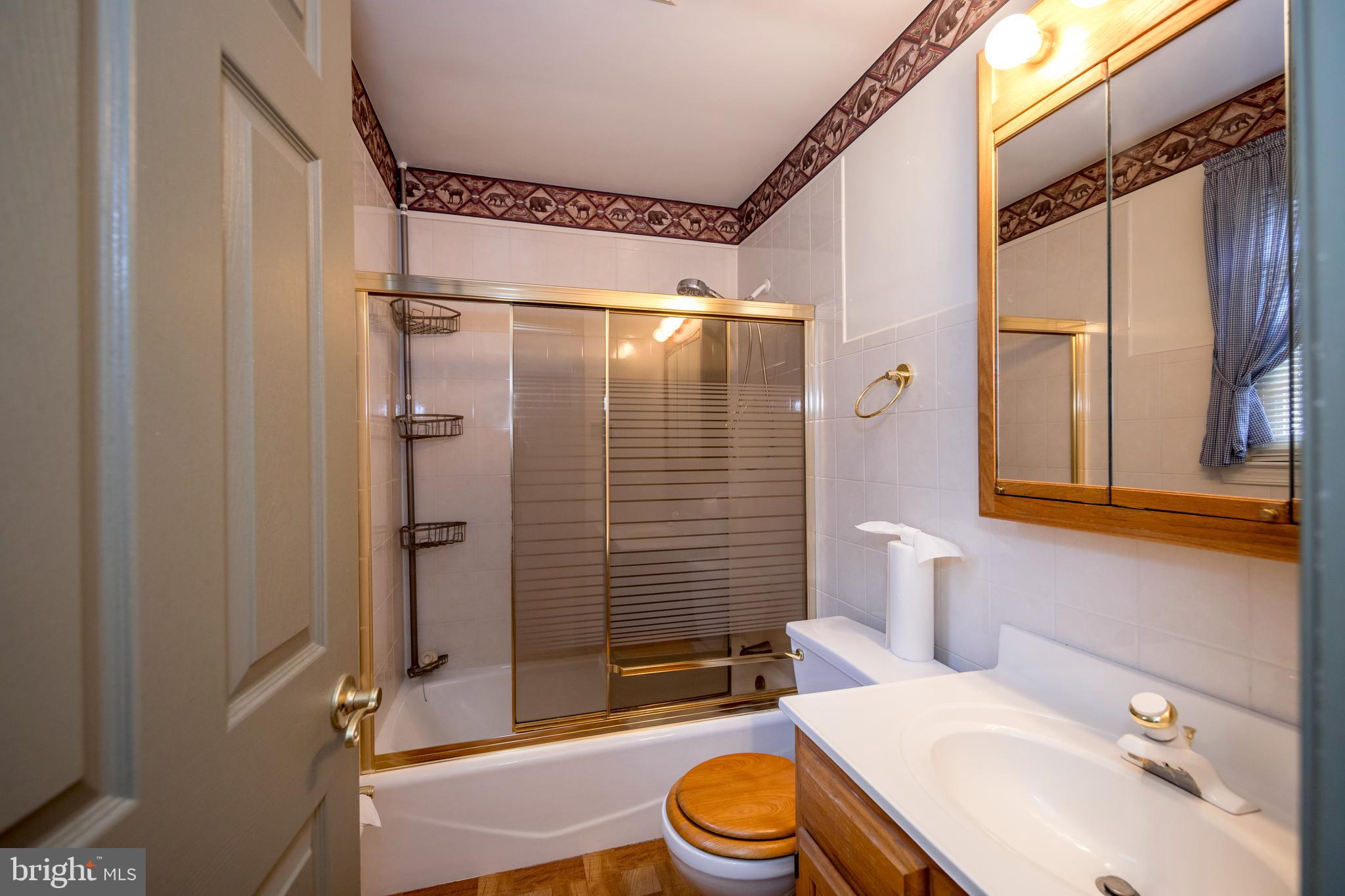 4300 Camellia Road Nottingham, MD 21236 - Photo 26 of 47 a bathroom with a sink toilet and shower