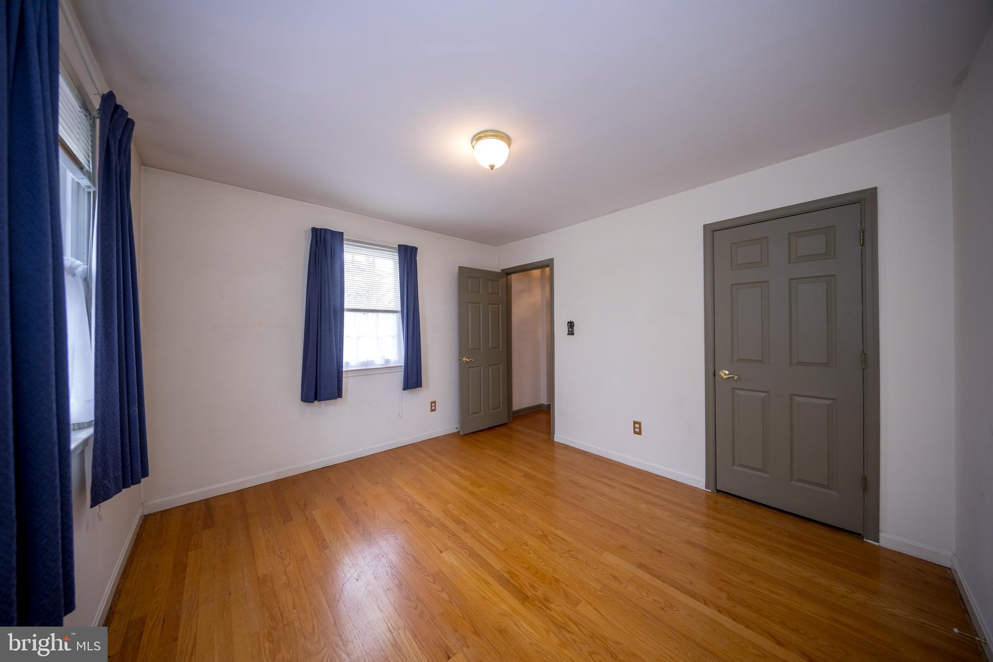 4300 Camellia Road Nottingham, MD 21236 - Photo 32 of 47 a view of an empty room with window and wooden floor