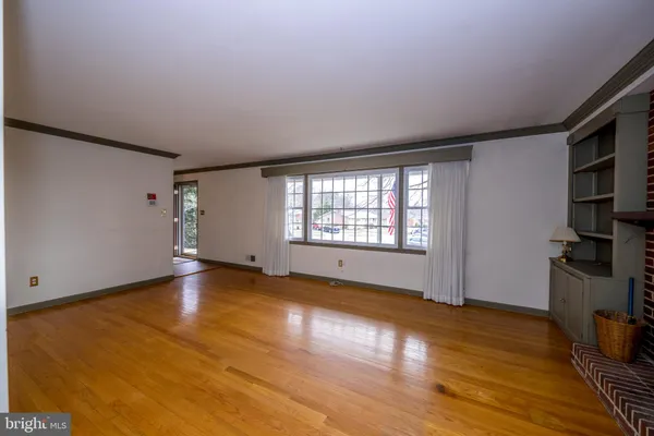 a view of room with window and hallway