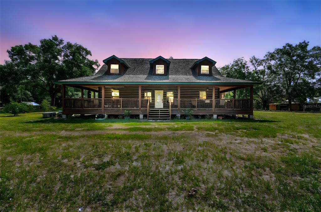 19708 Bower Road Dade City, FL 33523 - Photo 1 of 84 a front view of a house with a yard