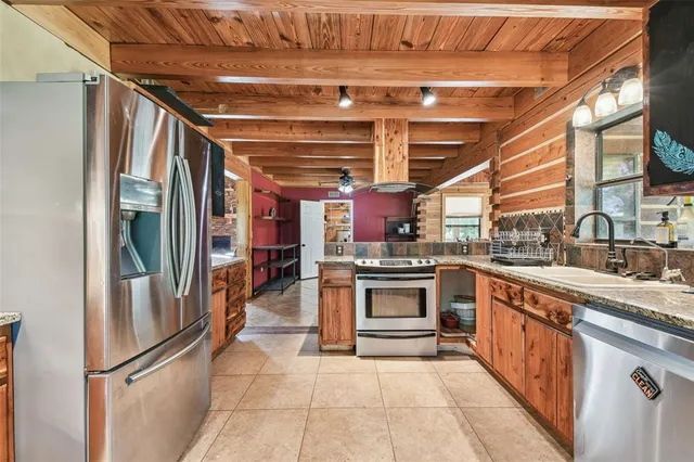 a room with wooden floors and pool table