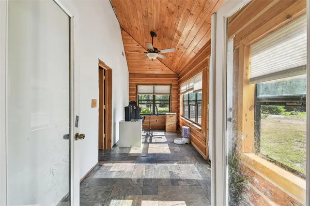 a view of a livingroom with furniture and windows