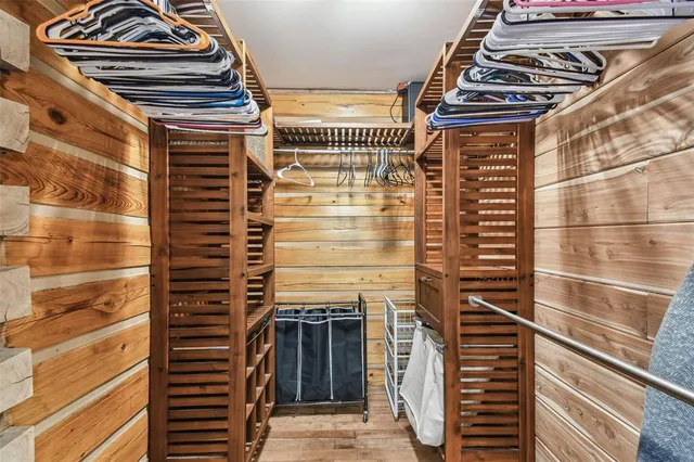 a view of a dining room with furniture wooden floor and chandelier