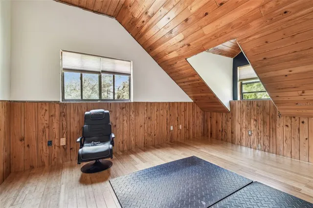 a bedroom with furniture and a chandelier