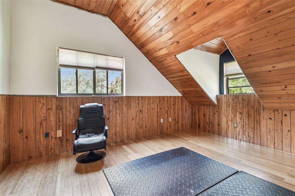 19708 Bower Road Dade City, FL 33523 - Photo 37 of 84 a view of wooden floor in an empty room