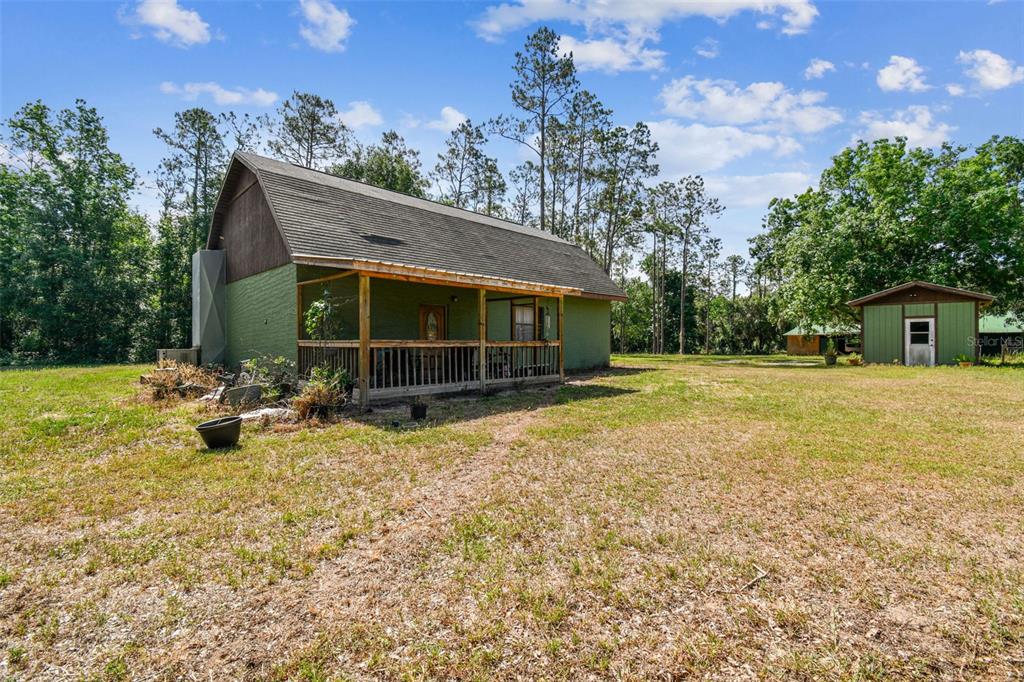 19708 Bower Road Dade City, FL 33523 - Photo 48 of 84 a view of house with backyard space and balcony