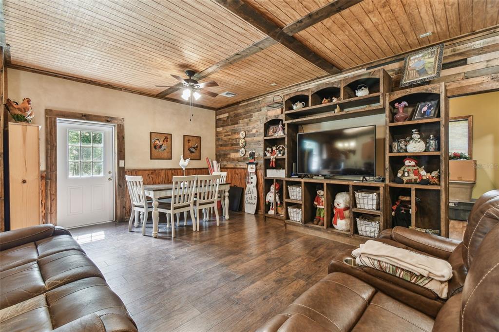 19708 Bower Road Dade City, FL 33523 - Photo 51 of 84 a living room with furniture and a flat screen tv