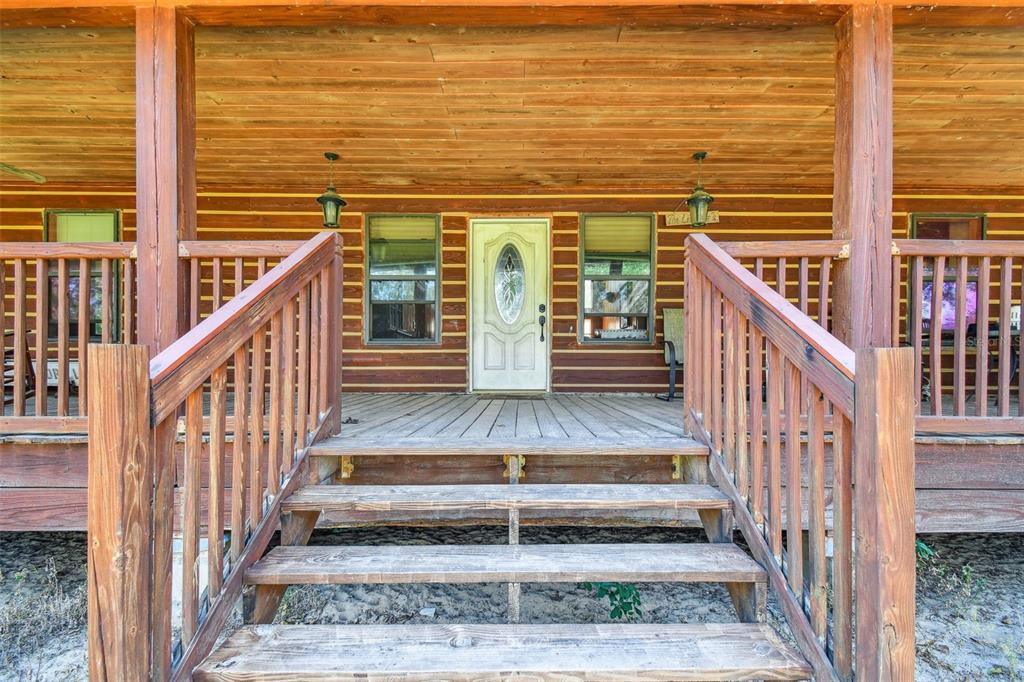19708 Bower Road Dade City, FL 33523 - Photo 7 of 84 a view of staircase with wooden floor and white walls