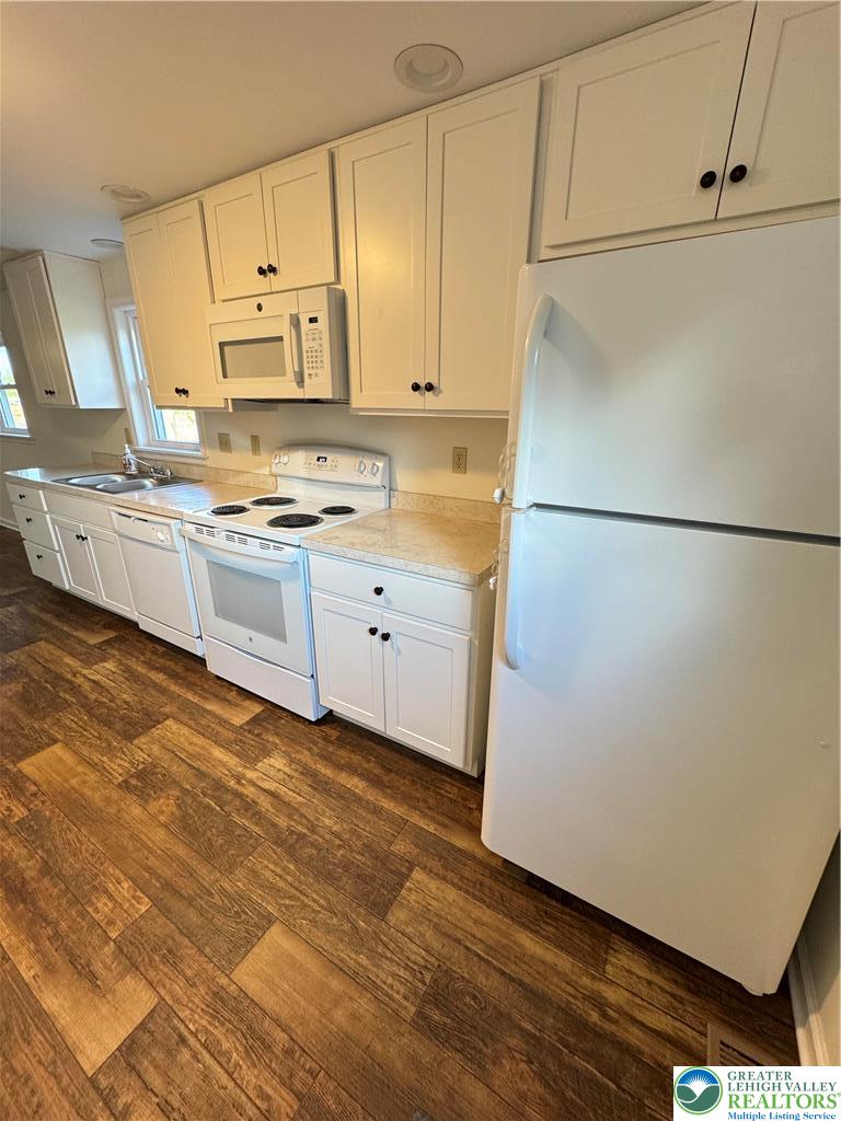 5460 Interchange Road Lehighton, PA 18235 - Photo 10 of 22 a kitchen with stainless steel appliances a refrigerator sink and white cabinets