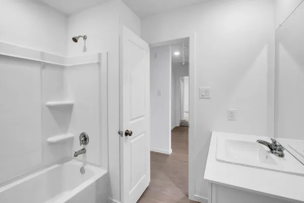 a bathroom with a bathtub sink and toilet