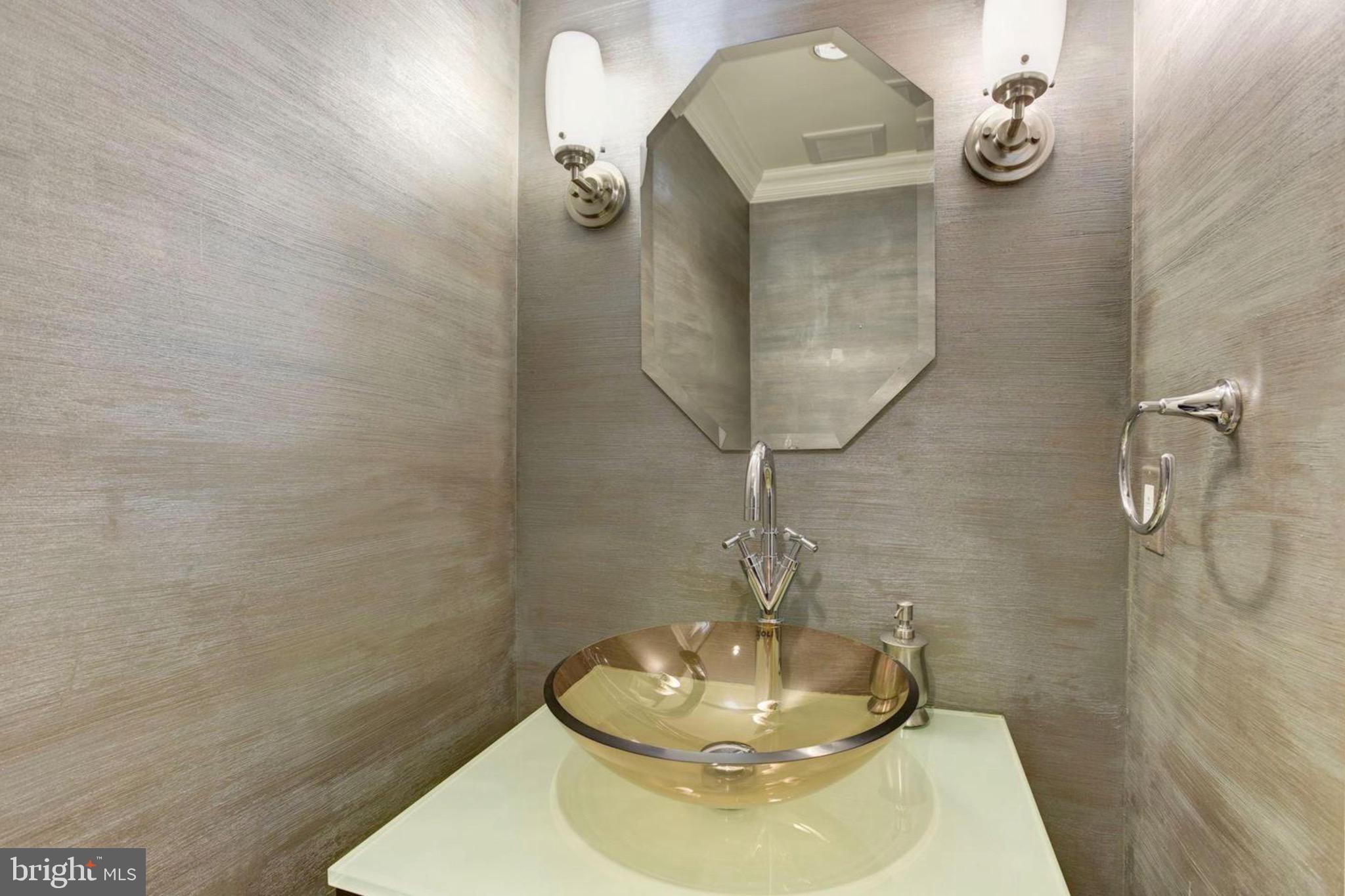 801 Key Highway, Unit 413 Baltimore, MD 21230 - Photo 21 of 58 a bathroom with a sink and a mirror