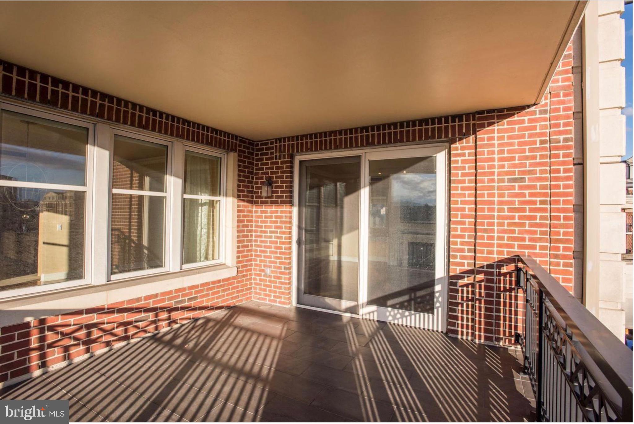 801 Key Highway, Unit 413 Baltimore, MD 21230 - Photo 35 of 58 a view of a balcony with wooden floor