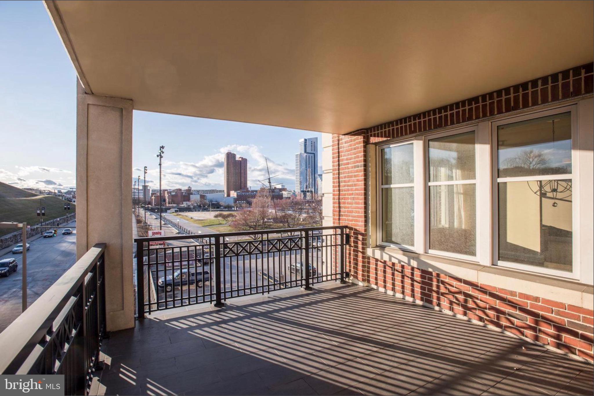 801 Key Highway, Unit 413 Baltimore, MD 21230 - Photo 38 of 58 a view of a balcony with wooden floor