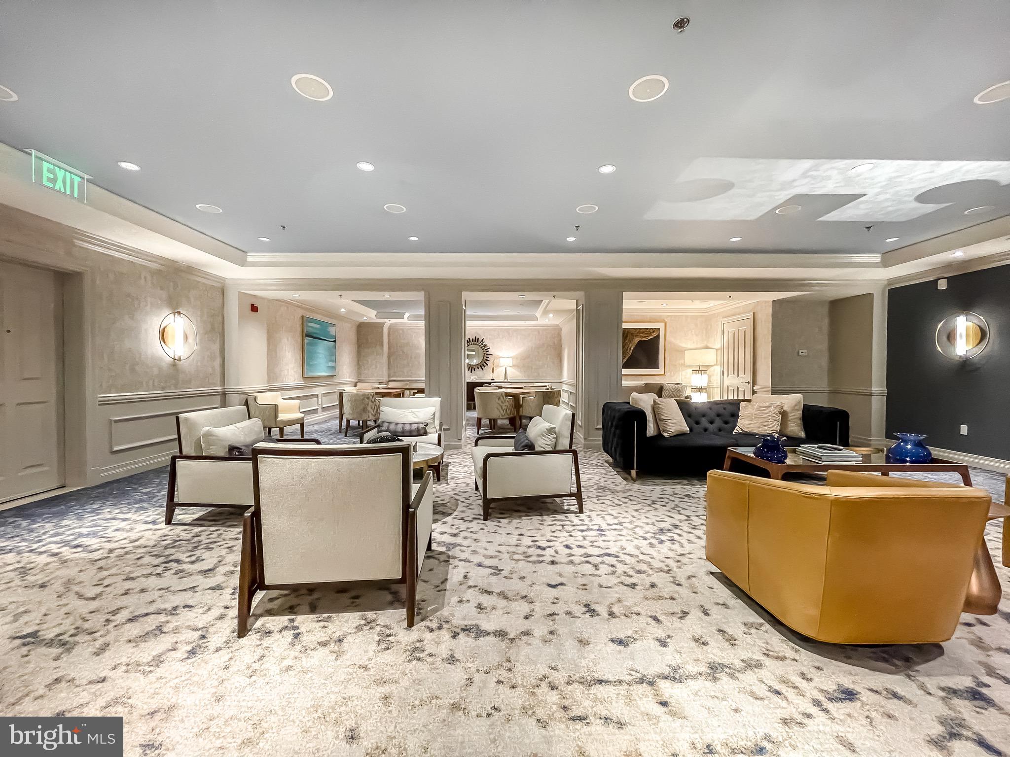 801 Key Highway, Unit 413 Baltimore, MD 21230 - Photo 44 of 58 a living room with furniture and a dining table with kitchen view