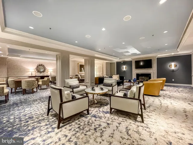 a large living room with stainless steel appliances kitchen island granite countertop a large kitchen counter top and stove