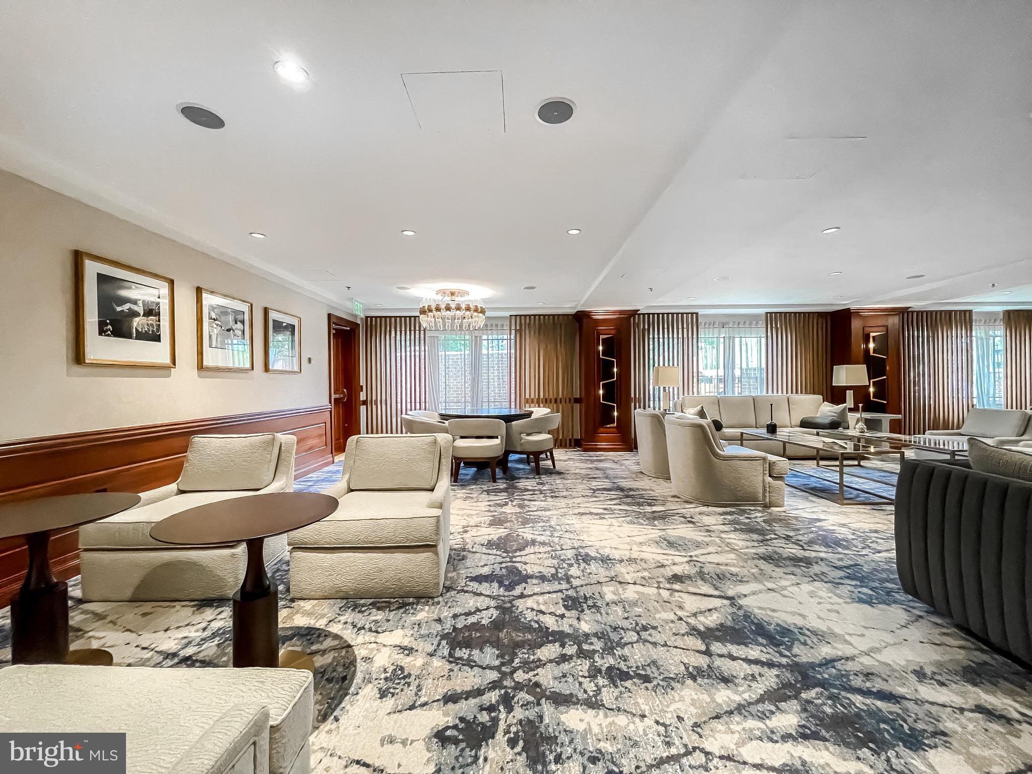801 Key Highway, Unit 413 Baltimore, MD 21230 - Photo 51 of 58 a living room with furniture and a dining table with kitchen view