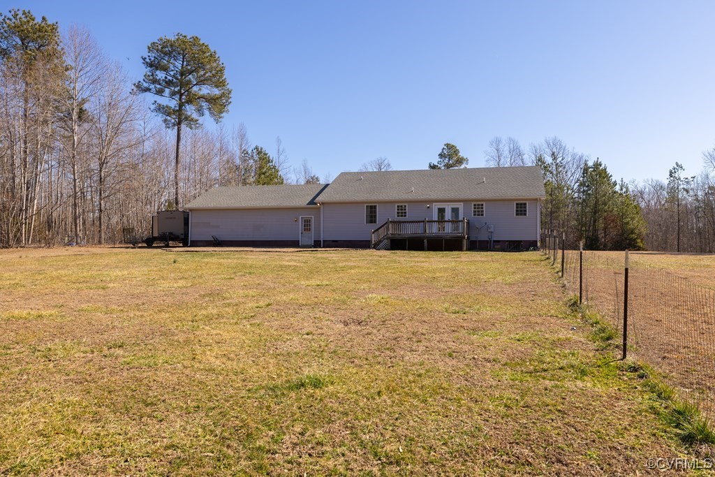 11272 Farmville Road Meherrin, VA 23954 - Photo 10 of 36 Rear view of property featuring a yard, a wooden d