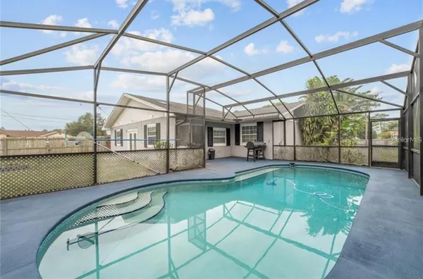 a view of a swimming pool with a porch
