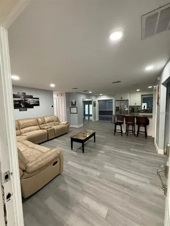 a living room with furniture and a table