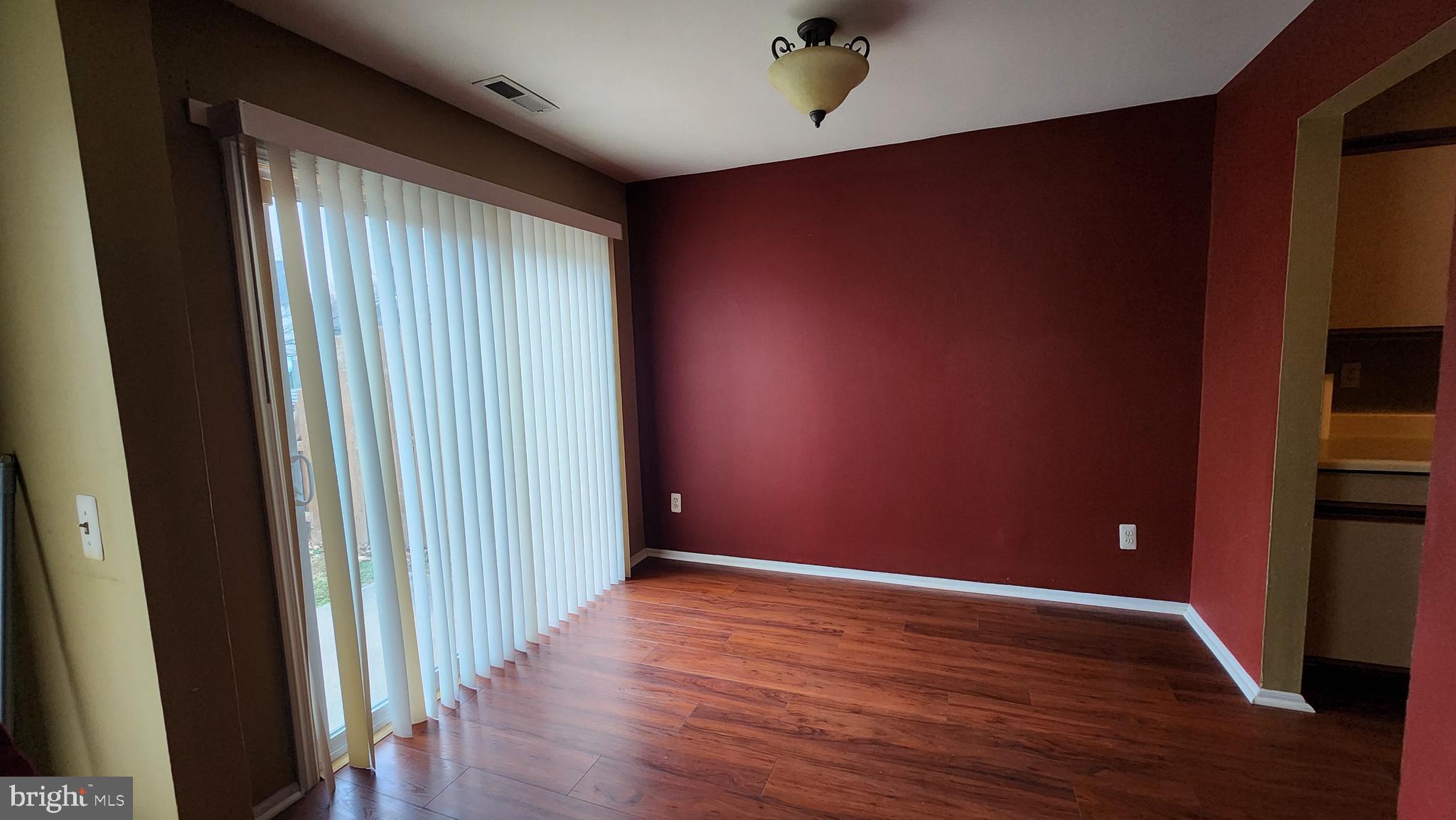 4 Nutmeg Drive Lumberton, NJ 08048 - Photo 6 of 18 an empty room with wooden floor and windows
