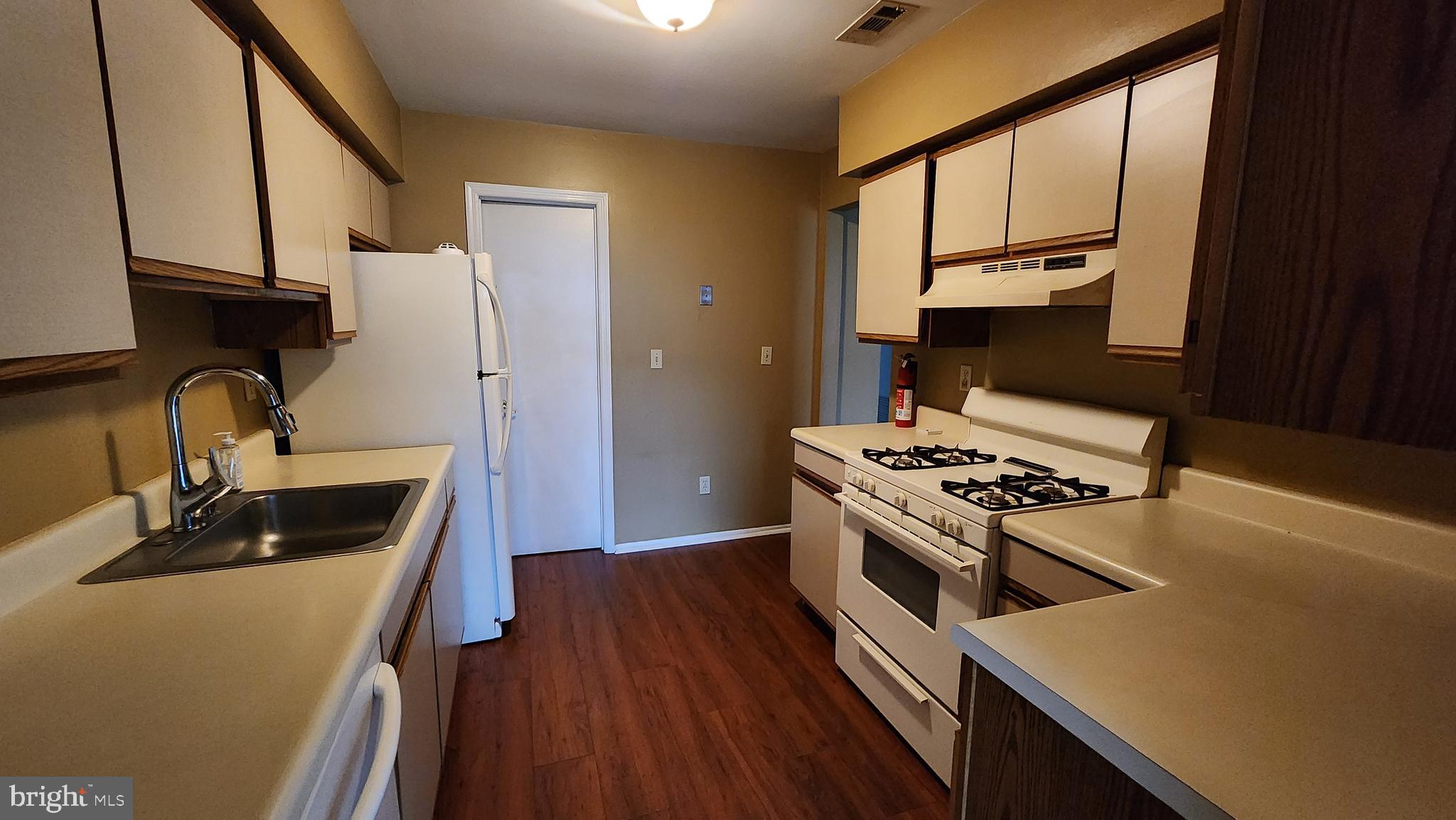 4 Nutmeg Drive Lumberton, NJ 08048 - Photo 8 of 18 a kitchen with stainless steel appliances a stove a sink and a refrigerator
