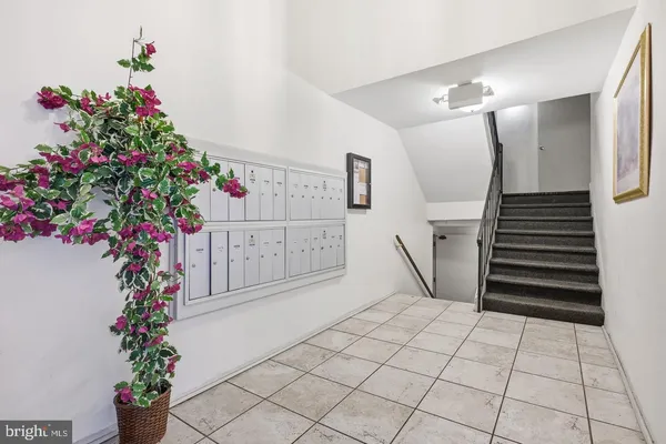 a entryway of a house with flower plants