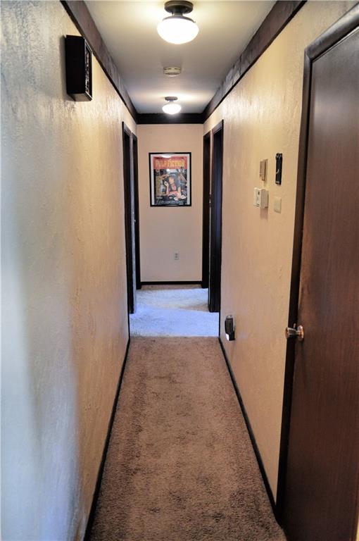 130 Hampton Court Butler, PA 16002 - Photo 8 of 22 a view of a hallway with wooden floor