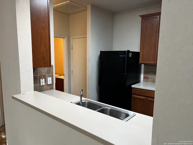 a bathroom with a sink and a large mirror