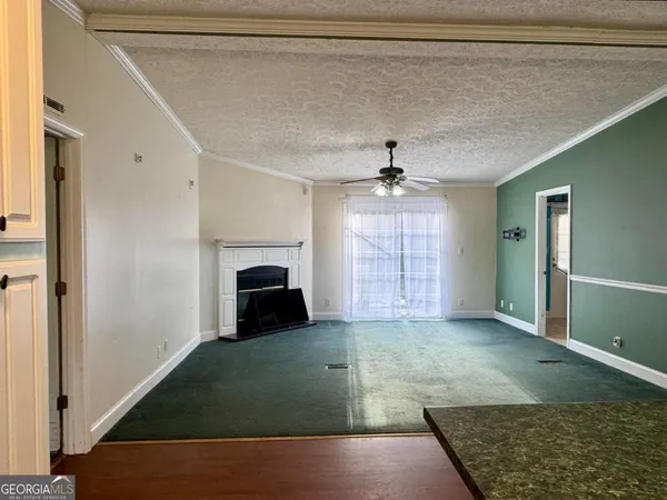 a bedroom with a bed and flat screen tv