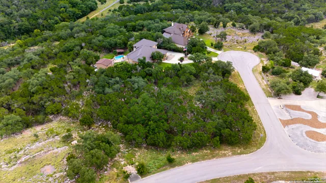a view of a lake with trees in the background
