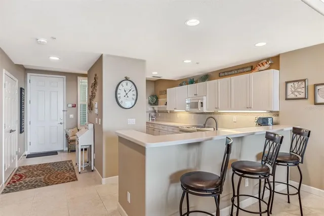a kitchen with a table and chairs in it