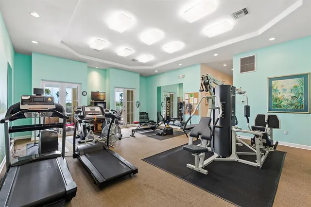 a view of a house with swimming pool and sitting area