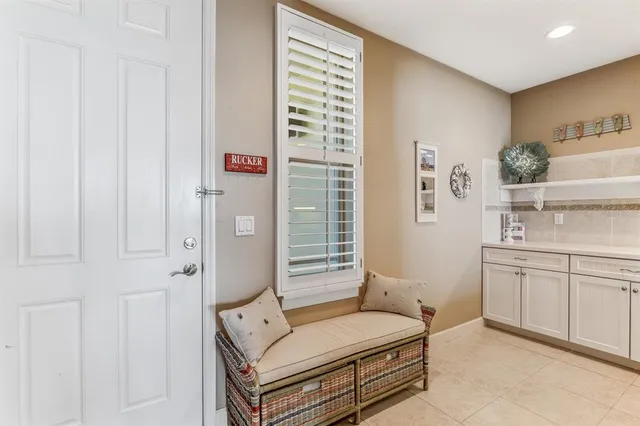 a spacious bedroom with a bed and a sink