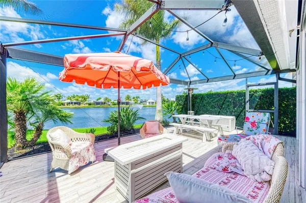 a view of an outdoor sitting area with furniture and backyard